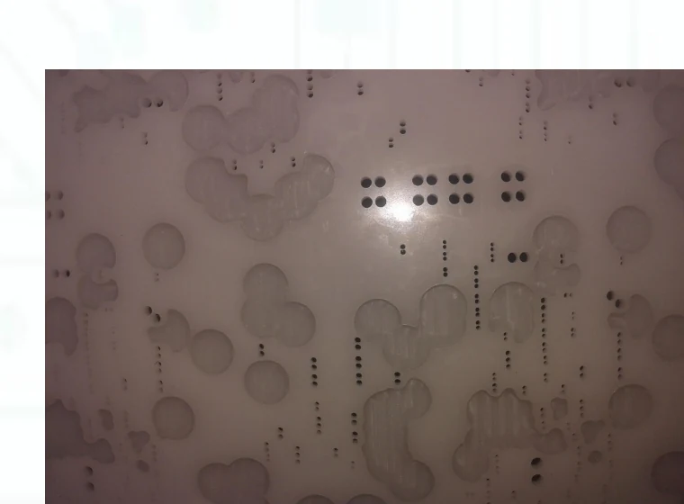 Resin stencil with red glue after cleaning