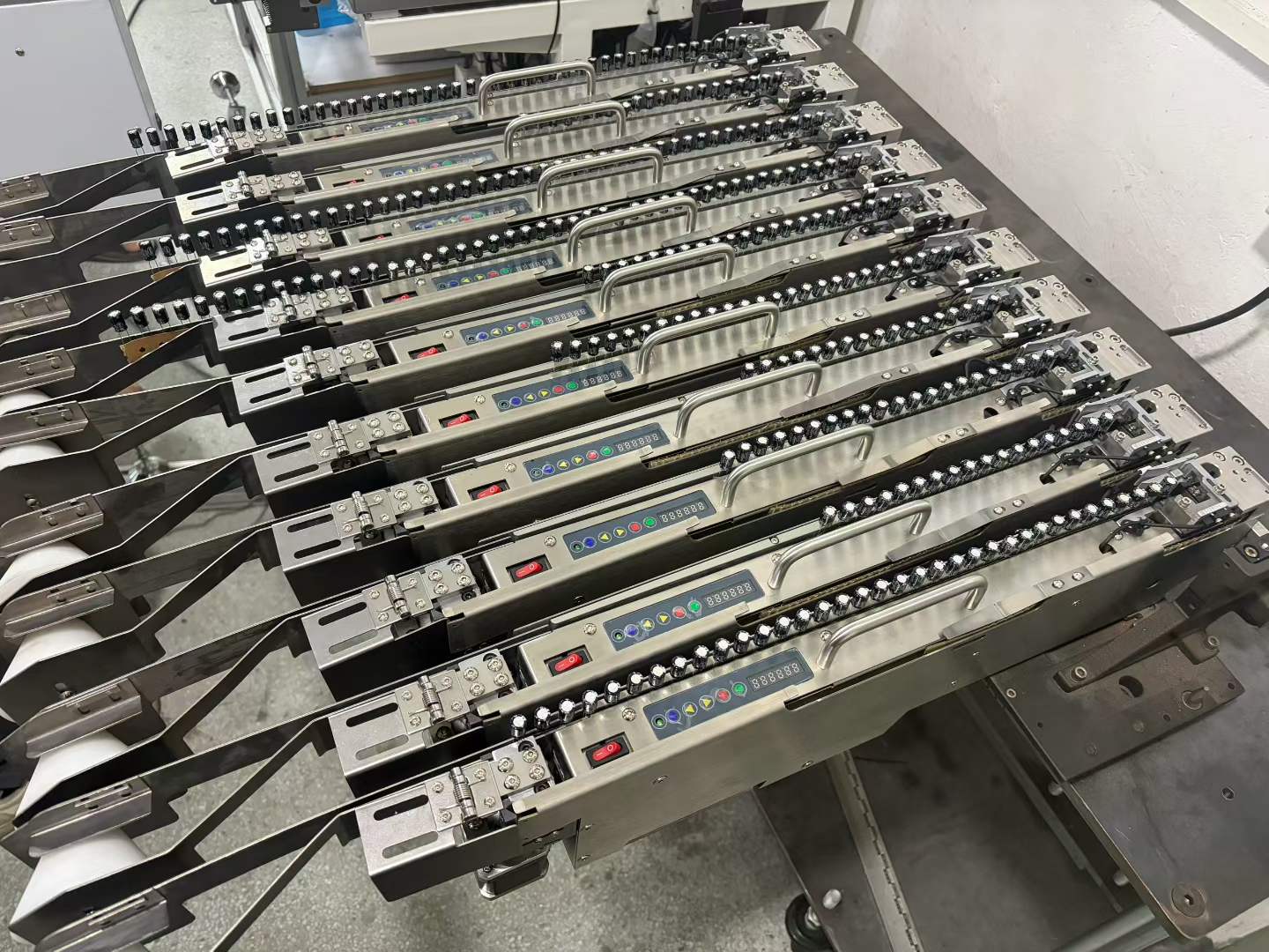 Bank of SMT tape feeders prepared for component supply