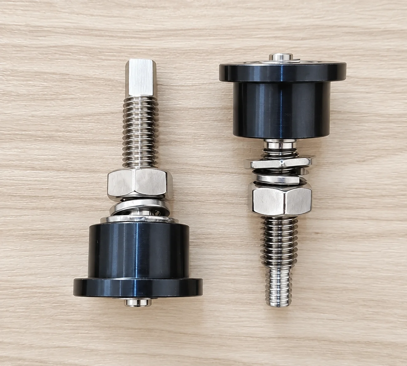 Reflow oven guide wheel assemblies with threaded mounting hardware