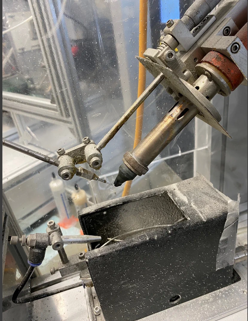 Soldering iron tip working inside an automatic soldering machine
