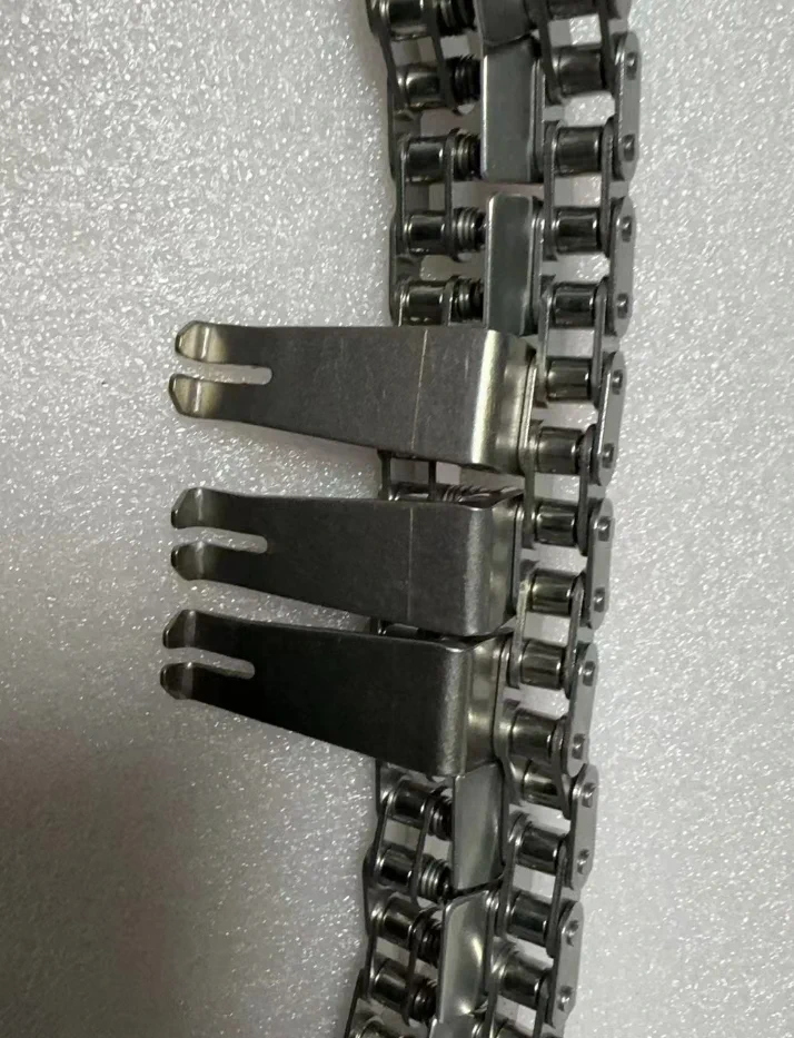 Titanium fingers installed on a wave soldering conveyor chain