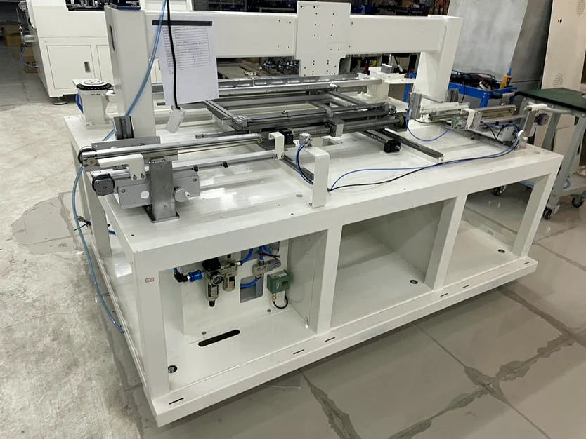 Rear view of a conveyor and pneumatic assembly