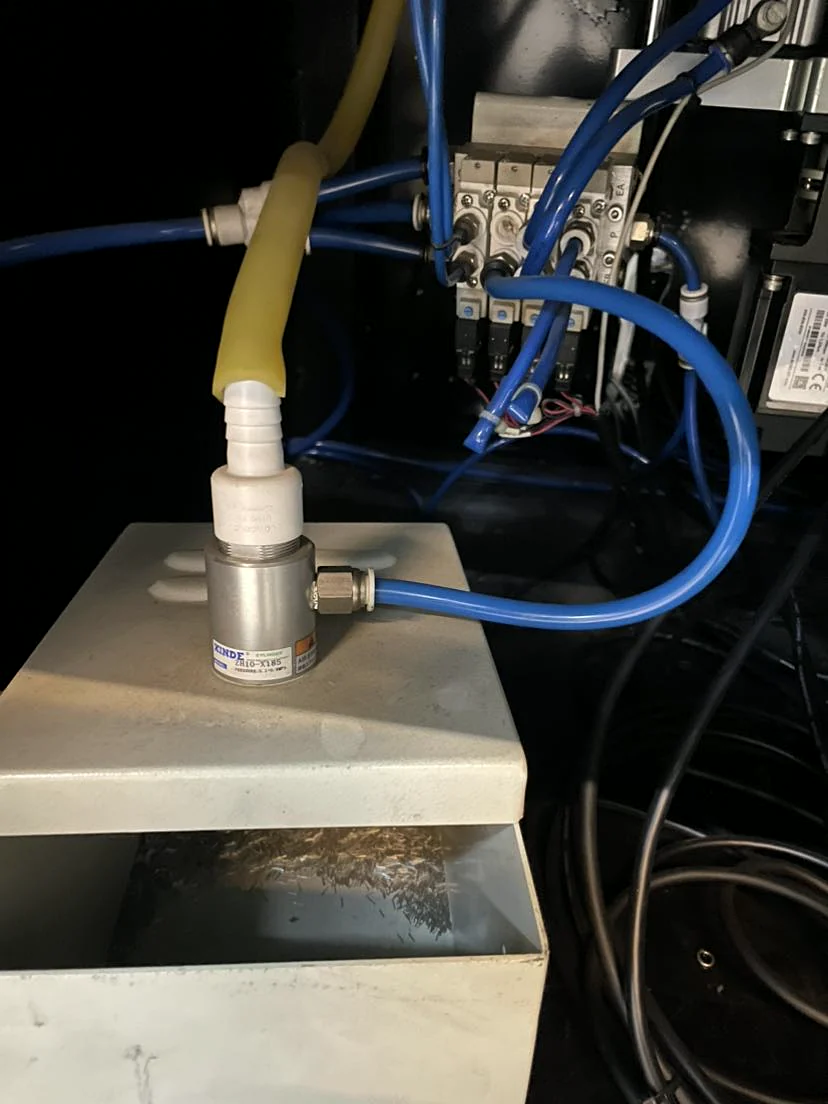 Pneumatic valves and tubing inside the machine